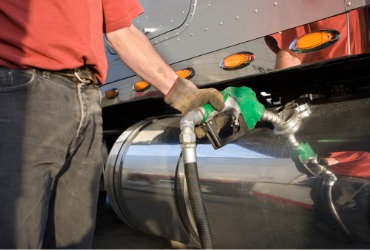 Man using diesel to fill up truck, thanks to Diesel Delivery in McLean County IL