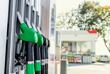 Green gas pumps at a gas station pump for gasoline delivery in Marshall County IL.