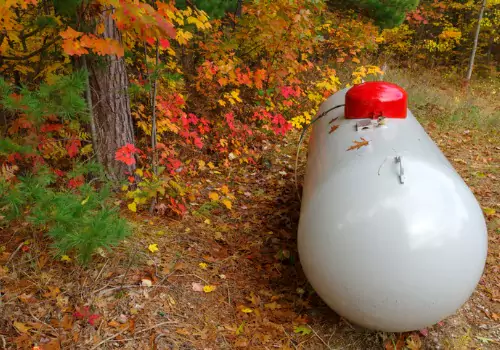 Propane tanks are seen in a rural area. Yoder Oil Inc. offers propane delivery service in Peoria IL.